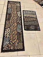 Runner and smaller rug laid out to show full pattern and relative sizes