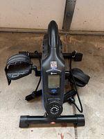 Top view showing LCD display, pedals with straps and tension dial