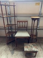 All four wooden furniture pieces grouped: corner étagère, side chair, plant stand, footstool