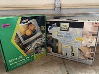 Both boxed kits standing side by side