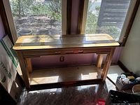 Full view of wood console table against window