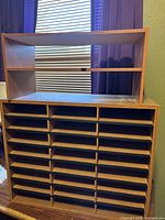 Front view showing all thirty slots and top shelf