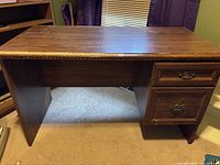 Front view of desk showing overall structure and drawer placement