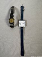 Both wristwatches together to show lot contents