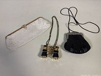 Group shot showing both evening bags and opera glasses
