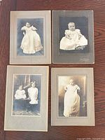 Front view showing all four mounted photographs