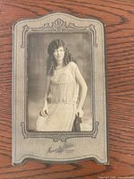 Front view of cabinet card showing portrait and ornate mount