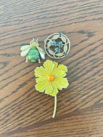 Front view of all three brooches