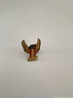 Front view of gold-tone Harley-Davidson enamel lapel pin