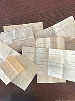 group of eight documents laid out showing variety and condition