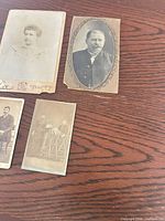 Overview of four photographs on wood surface