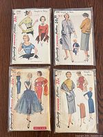 Front view of four Simplicity pattern envelopes