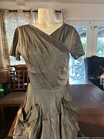 Front view of pin-striped dress on mannequin