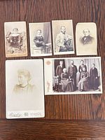 Overview of all six photographs arranged on wooden surface