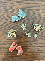 All five jewelry pieces laid out
