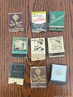Front view of all nine matchbooks showing individual graphics
