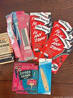 Group shot of all packaging cards, bamboo pointer and loose sliders