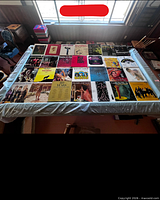 Overhead view of entire assortment of vinyl LP jackets laid on table