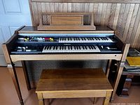 Front view of Yamaha Electone BK-20SI organ with bench