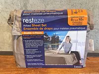 Front of sealed Resteze airbed sheet set package