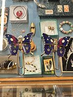 Front view showing both enamel butterfly paperclips