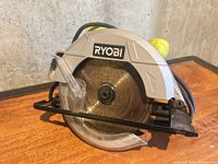 Front view showing Ryobi branding, blade and guards