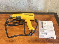 Wagner HT3500 K heat gun with cord and manual on table