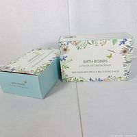Two boxes of bath bombs front view