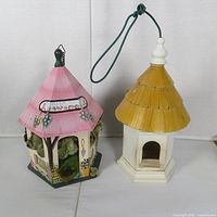 Front view of both decorative birdhouses