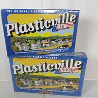 Front view of two sealed Plasticville USA boxes