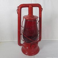 Full view of red Dietz kerosene lantern