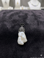 Front view of pendant showing baroque pearl, rhinestone-studded cap, and bail