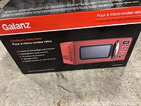 Sealed retail box front showing Galanz Retro microwave image and specifications