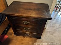Top and front view showing full nightstand, scratches on surface