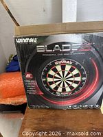 Front of boxed Winmau Blade 5 dartboard