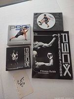 Full lot: DVD wallet, loose disc, manuals and inserts visible
