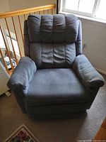 Front view of blue fabric rocker recliner