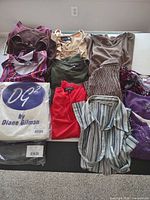 All 13 clothing items laid out including two sealed DG2 packages