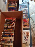 Two boxes of assorted Disney and family VHS tapes