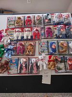 Overall view of carded and loose Ty Teenie Beanies on display board