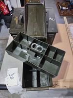 Top view of two cans open showing interior plastic tray compartments