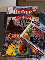 Stacked view of all four game boxes showing titles and artwork