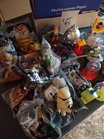 Overview showing sealed and loose Happy Meal toys