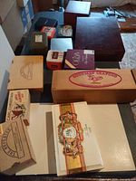 Overview of wooden boxes and tins on table