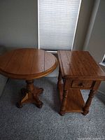 Round and rectangular Oak Express tables side by side