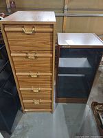 Front view of chest with six drawers and glass display cabinet side by side
