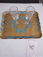 top view of ornate tray with two flutes