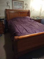 Full view of queen sleigh bed frame with headboard and footboard