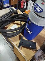 Vacuum canister, hose, bracket and accessories overview