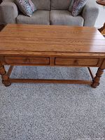 Front view showing two drawers, turned legs and stretcher